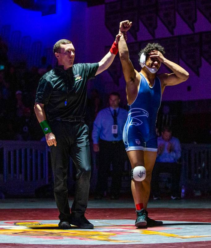 Foothill's Micah Schneider is awarded the win over Green Valley's Derek Recktenwald in their 16 ...