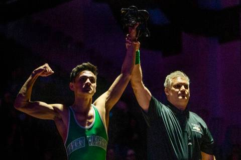 Green Valley's David Kalayanaprapruit is awarded the win over Reed's Alejandro Casarez in their ...