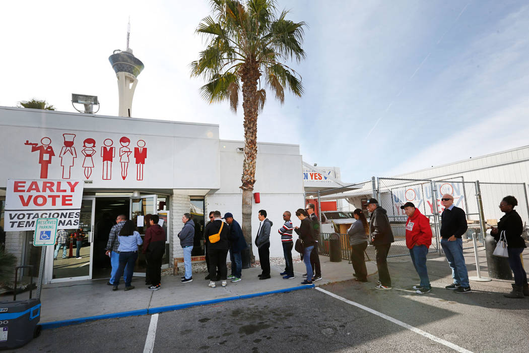 People line up to vote on the first day of early voting in the Nevada Democratic Party’s ...