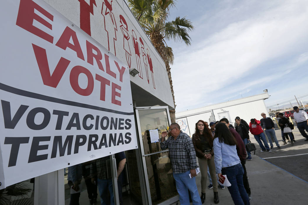 People line up to vote on the first day of early voting in the Nevada Democratic Party's presid ...