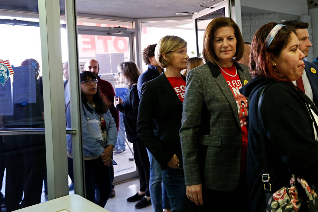 Sen. Catherine Cortez Masto, D-Nev., right, second from right, and Rep. Susie Lee, D-Nev., thir ...