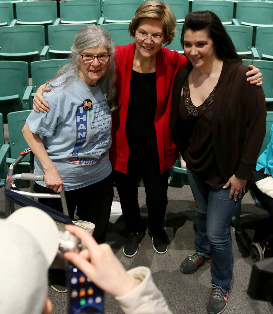 Democratic Presidential Candidate Elizabeth Warren, center, takes a photo with Marlene Pikus, l ...