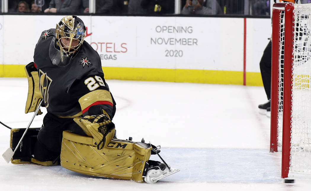 A shot flies wide past Vegas Golden Knights goalie Marc-Andre Fleury during the first period of ...