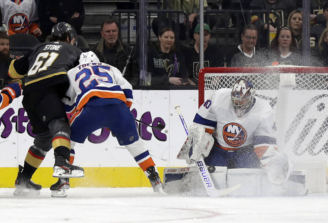 New York Islanders goalie Semyon Varlamov blocks a shot from Vegas Golden Knights right wing Ma ...
