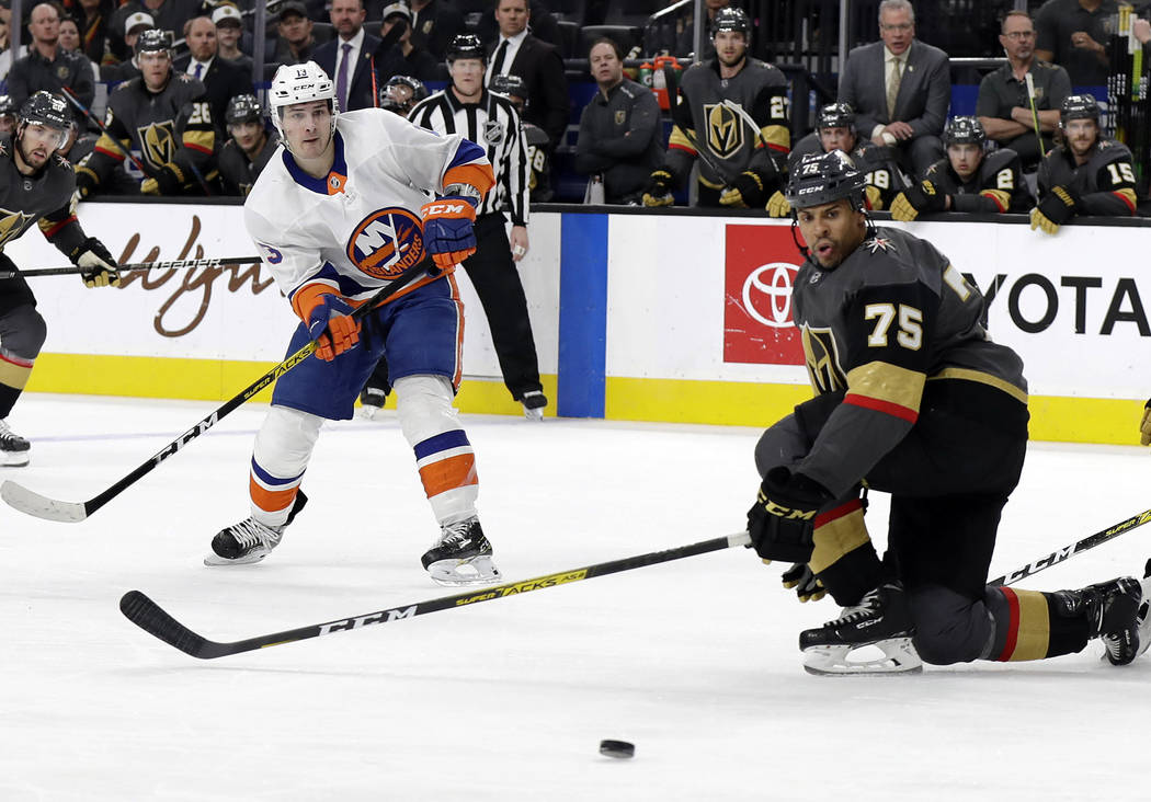 New York Islanders forward Mathew Barzal (13) watches his shot as Vegas Golden Knights right wi ...