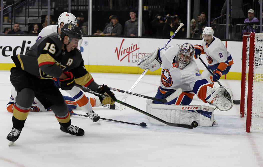 Vegas Golden Knights right wing Reilly Smith (19) shoots as New York Islanders goalie Semyon Va ...