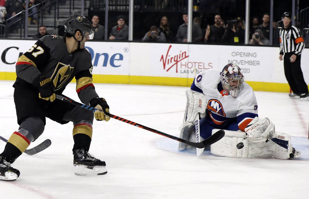 Vegas Golden Knights left wing Max Pacioretty (67) shoots as New York Islanders goalie Semyon V ...