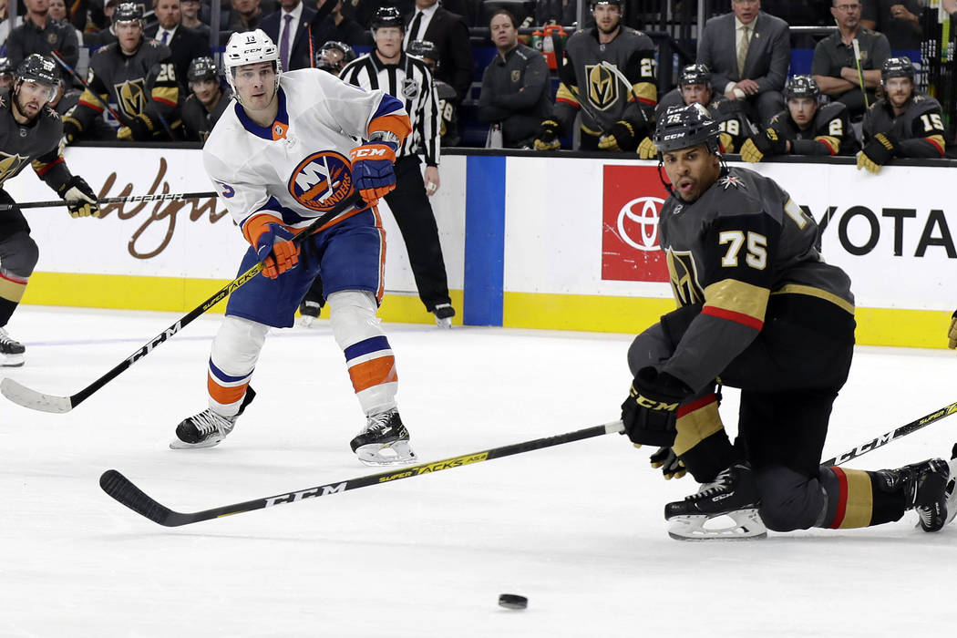 New York Islanders forward Mathew Barzal (13) watches his shot as Vegas Golden Knights right wi ...