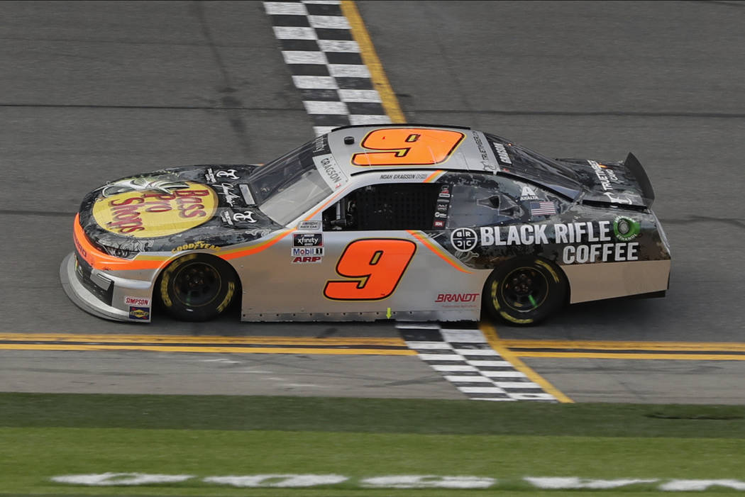 Noah Gragson crosses the finish line to win the NASCAR Xfinity series auto race at Daytona Inte ...