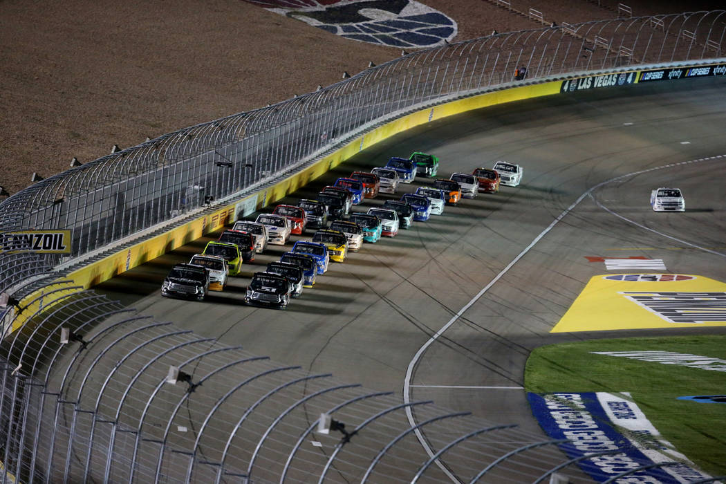 Kyle Busch (51) leads the pack during a re-start in the Strat 200 NASCAR Truck Series race at L ...