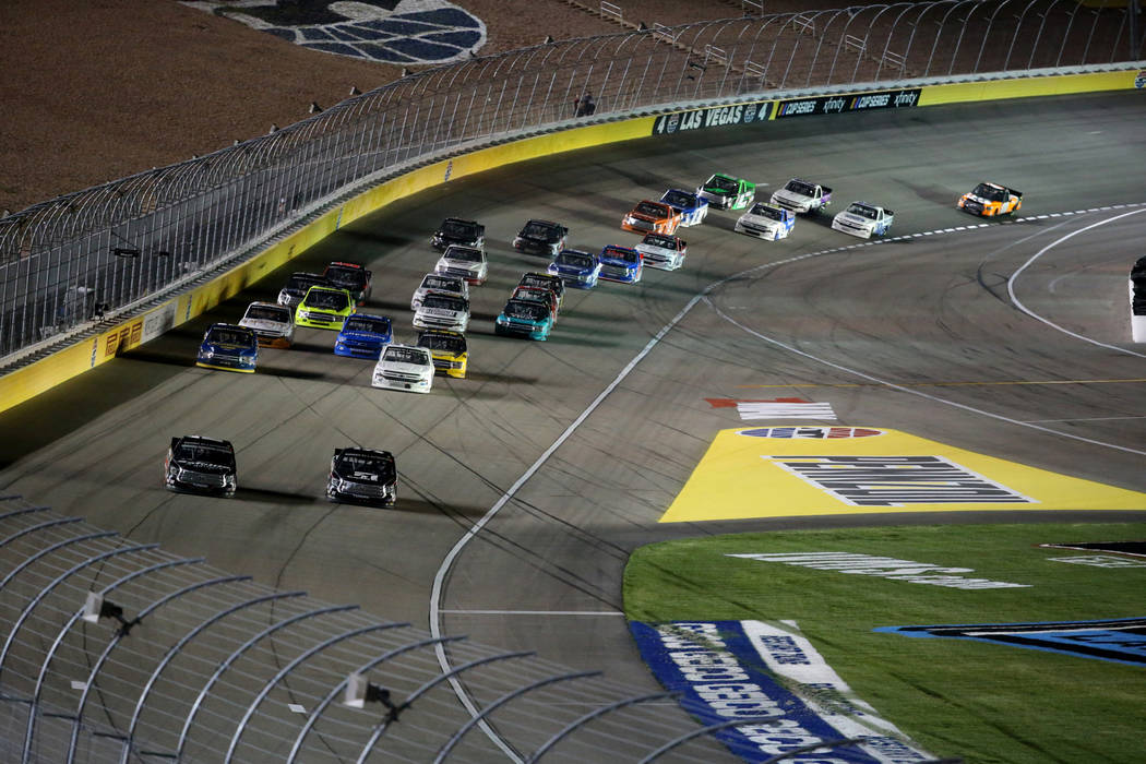Kyle Busch (51) Christian Eckes (18) battle for the lead during the Strat 200 NASCAR Truck Seri ...