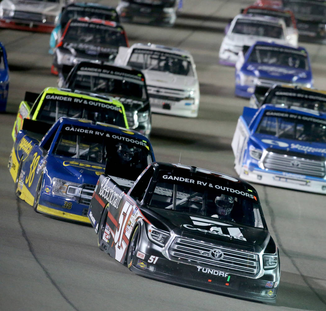 Kyle Busch (51) leads the pack during a re-start in the Strat 200 NASCAR Truck Series race at L ...
