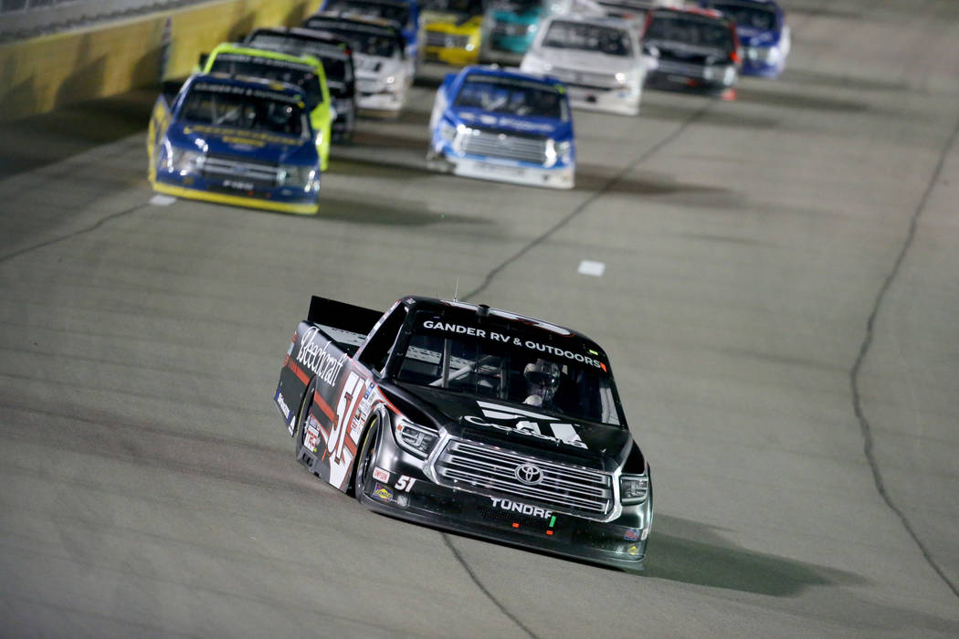 Kyle Busch (51) pulls away from the pack after a re-start in the Strat 200 NASCAR Truck Series ...