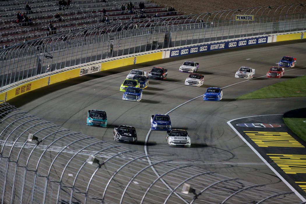 Kyle Busch (51) and Sheldon Creed (2) battle for the lead during the Strat 200 NASCAR Truck Ser ...