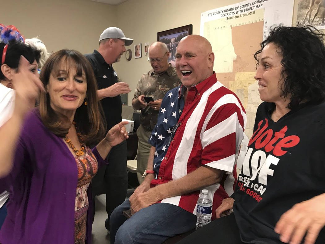 FILE - In this June 12, 2018, file photo, Nevada brothel owner Dennis Hof, second from right, c ...