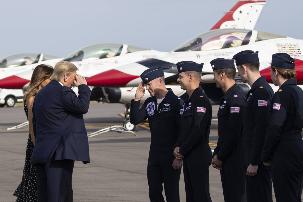 President Donald Trump, accompanied by first lady Melania Trump, greets members of the U.S. Air ...