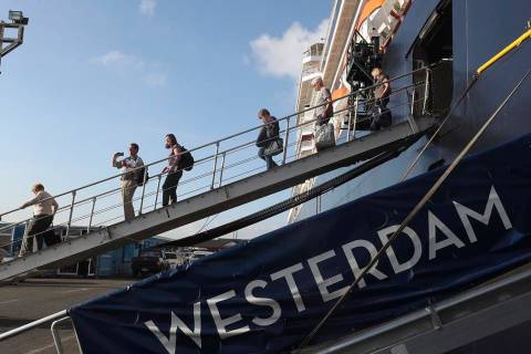 Passengers of the MS Westerdam, owned by Holland America Line disembark from the MS Westerdam, ...