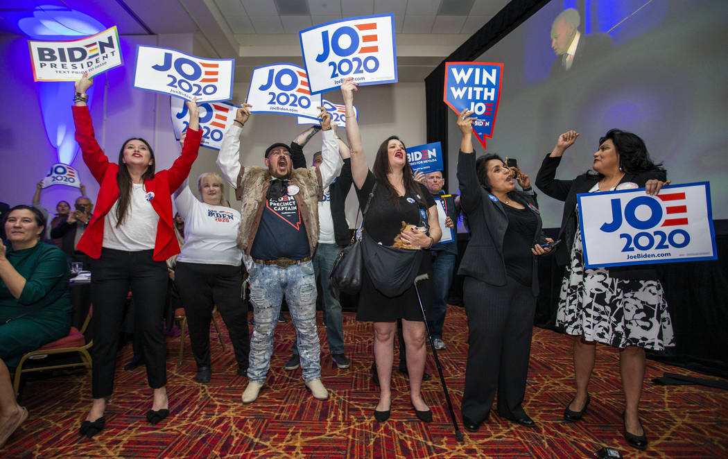 Former Vice President Joe Biden supporters cheer as he speaks during the Clark County Democrats ...