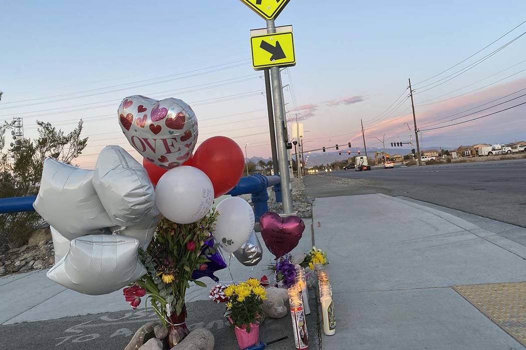 A memorial for a brother and sister hit by a truck on Friday, Feb. 14, 2020, sits next to a cro ...
