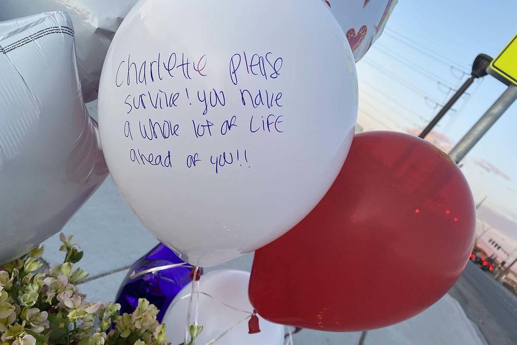 A memorial for a brother and sister hit by a truck on Friday, Feb. 14, 2020, sits next to a cro ...