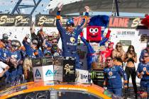 Race car driver Brad Keselowski celebrates in victory lane after winning the South Point 400 NA ...
