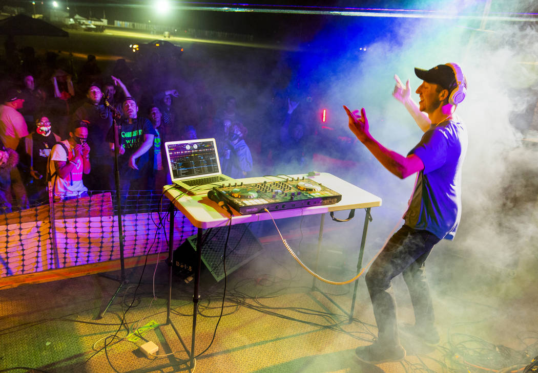 DJ Initiate performs before festivalgoers on the main stage during the Alienstock festival on S ...