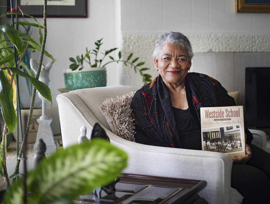 Brenda J. Williams, author of "Westside School: Our School Our Time," holds the book at her hom ...