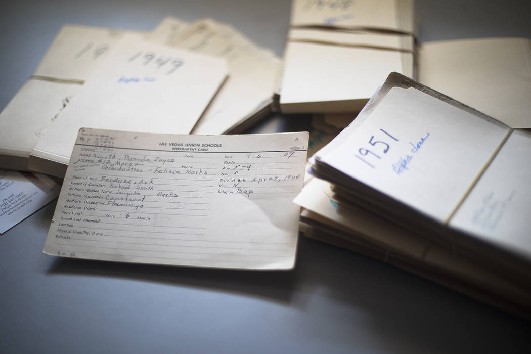 Stacks of enrollment cards for Westside School are on the desk of Brenda Williams, who helped c ...