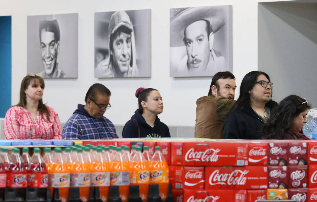 Voters line up during the last day of early voting in the Nevada Democratic caucuses at Cardena ...