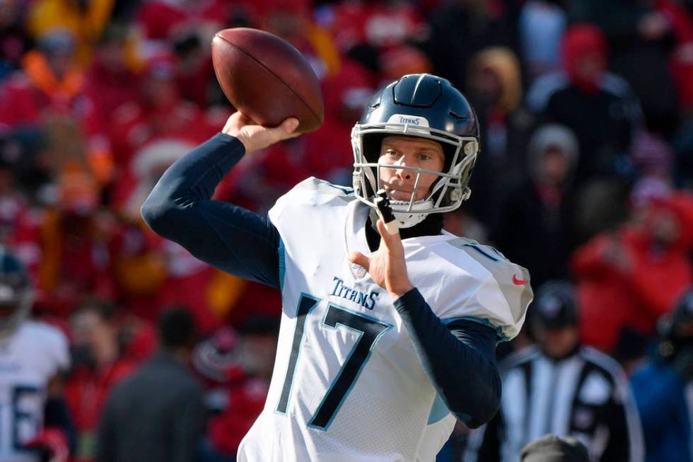 Tennessee Titans' Ryan Tannehill warms up before the NFL AFC Championship football game against ...