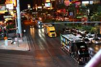 The haulers of Chris Buescher (37) and Kyle Busch (18) parade down the Las Vegas Strip near Har ...