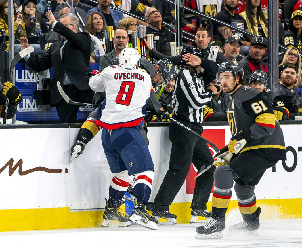 Washington Capitals left wing Alex Ovechkin (8) blasts Vegas Golden Knights center William Kar ...