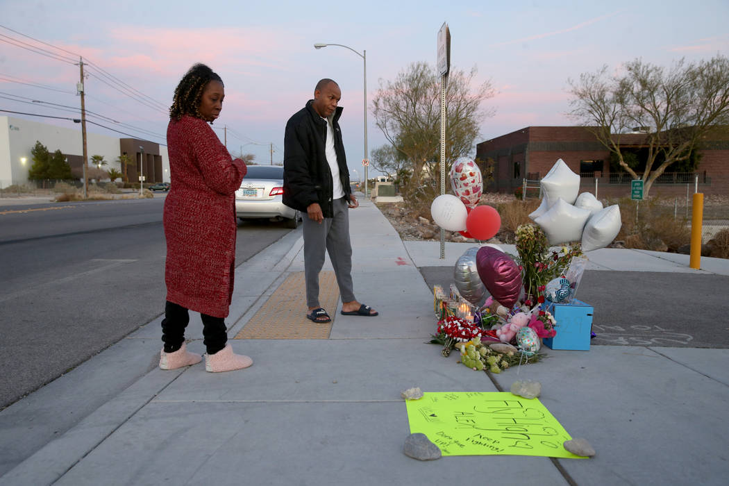 Michelle Johnson and Roy Simms of North Las Vegas pays her respects Monday, Feb. 17, 2020, at a ...