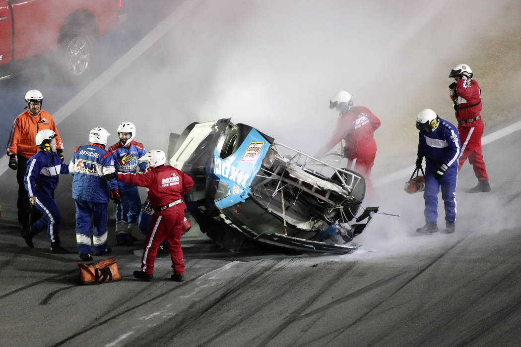 Rescue workers arrive to check on Ryan Newman after he was involved in a wreck on the last lap ...