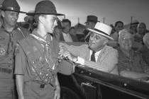 In this July 8, 1937 file photo, President Franklin D. Roosevelt stops briefly to pin an Eagle ...