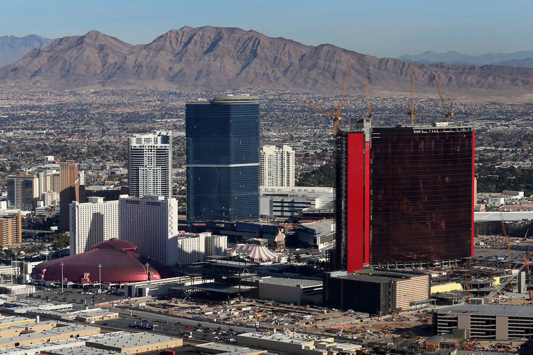 An aerial view of the Drew Las Vegas, center, and Resorts World Las Vegas, right, from the Good ...