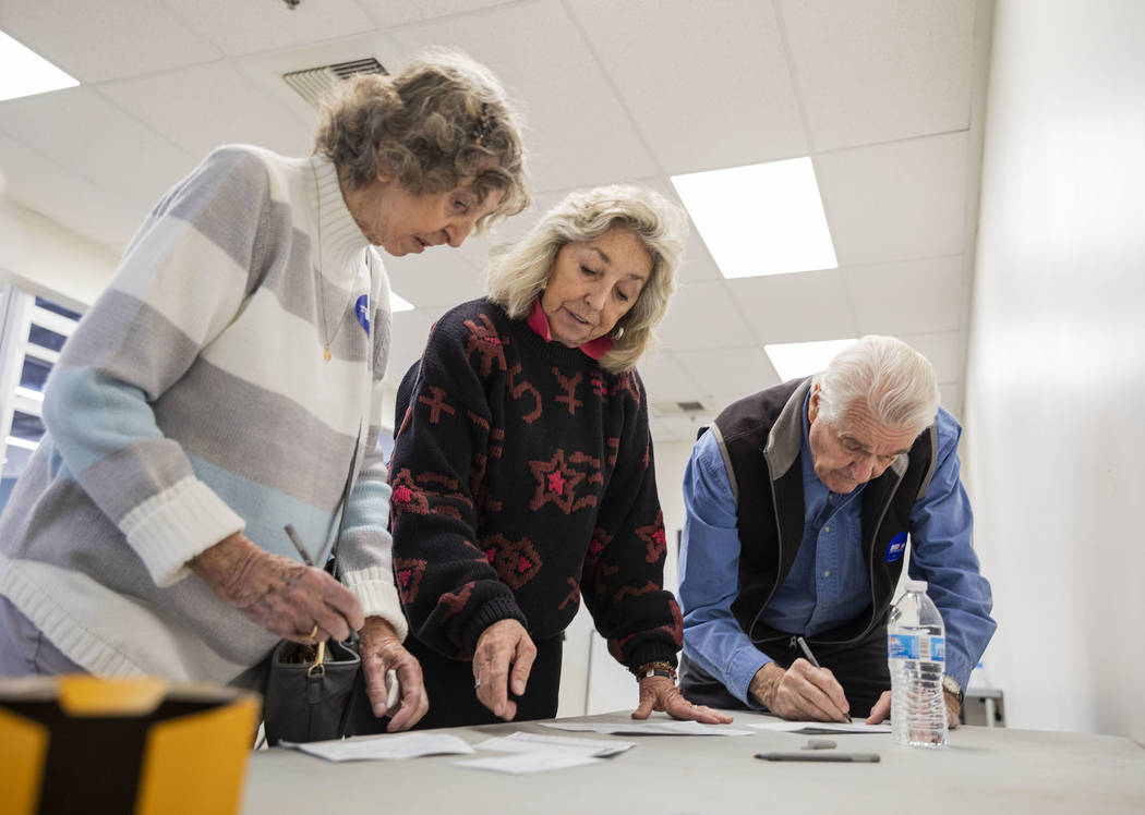 Elizabeth Titus, left, and Rep. Dina Titus, D-Nev., center and husband Thomas Wright cast their ...