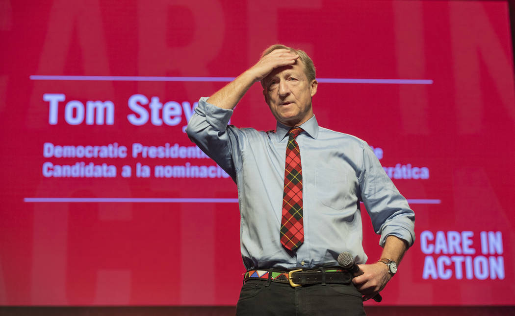 Democratic presidential candidate Tom Steyer listens as a question is presented during a Care i ...