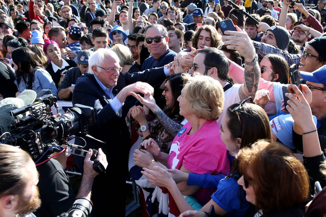 Vermont Sen. Bernie Sanders shakes hands with supporters during a Get Out the Early Vote Rally ...