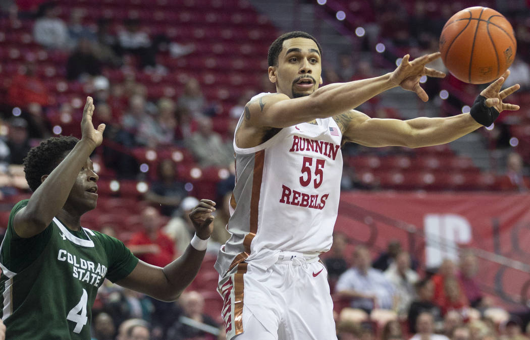 UNLV Rebels guard Elijah Mitrou-Long (55) runs the fast break with Colorado State Rams guard Is ...