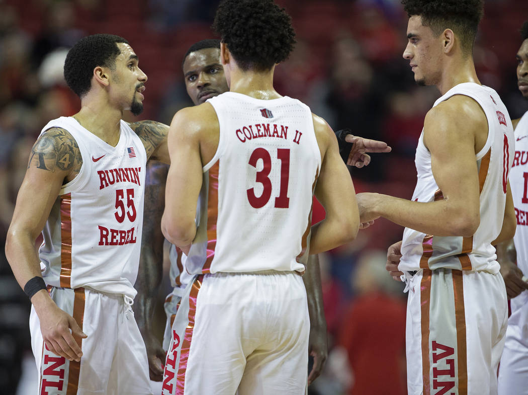 UNLV Rebels guard Elijah Mitrou-Long (55) directs teammates Marvin Coleman (31) and Jay Green ( ...