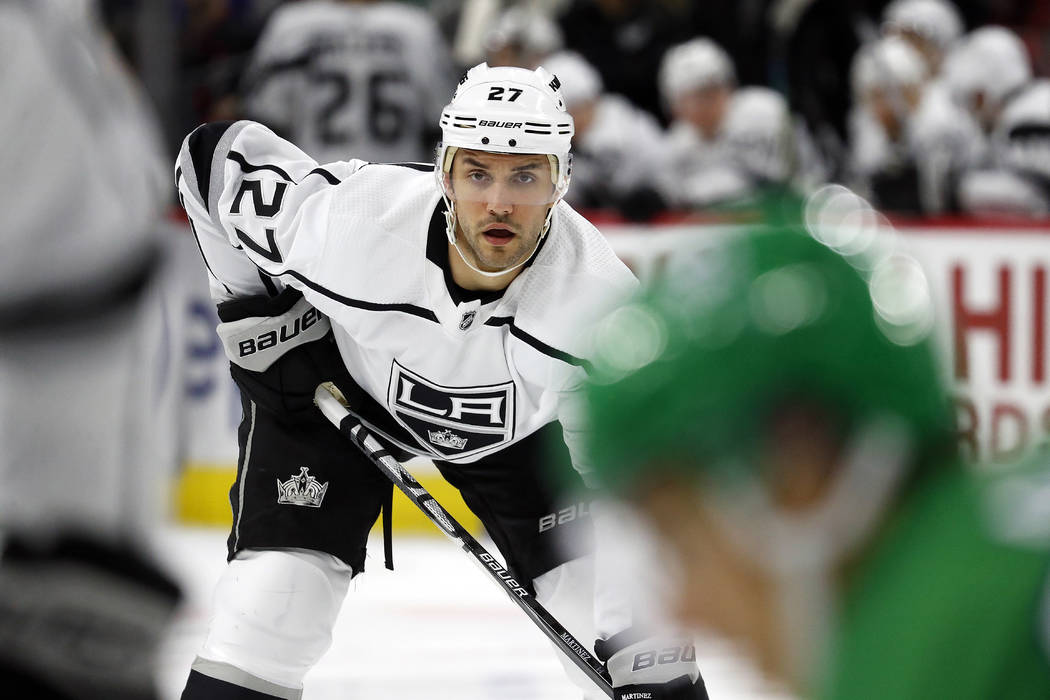 Los Angeles Kings' Alec Martinez (27) waits for a face-off against the Carolina Hurricanes duri ...