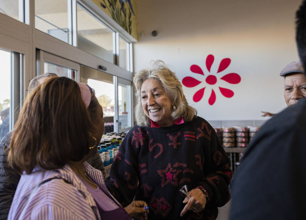 Rep. Dina Titus, D-Nev., greets LaSonia Dixon, 77, of North Las Vegas as they wait in line to c ...