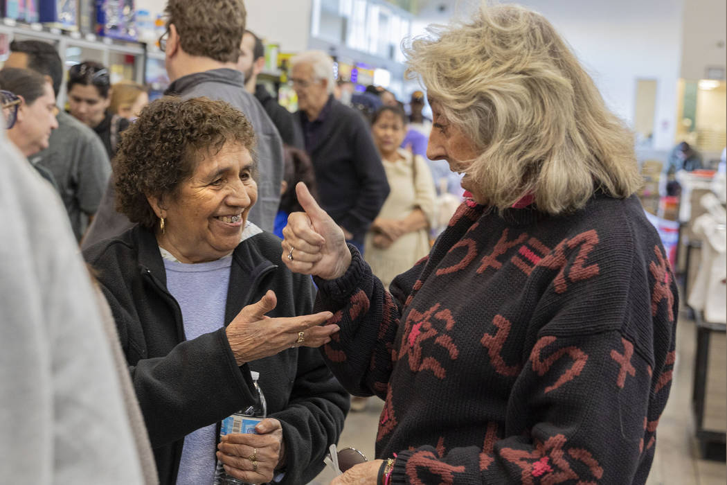 Guadalupe Cantu, 83, of Las Vegas, left, speaks with Rep. Dina Titus, D-Nev., as they wait in l ...