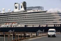 Two Cambodian military helicopters are parked at the port where the MS Westerdam is docked in S ...