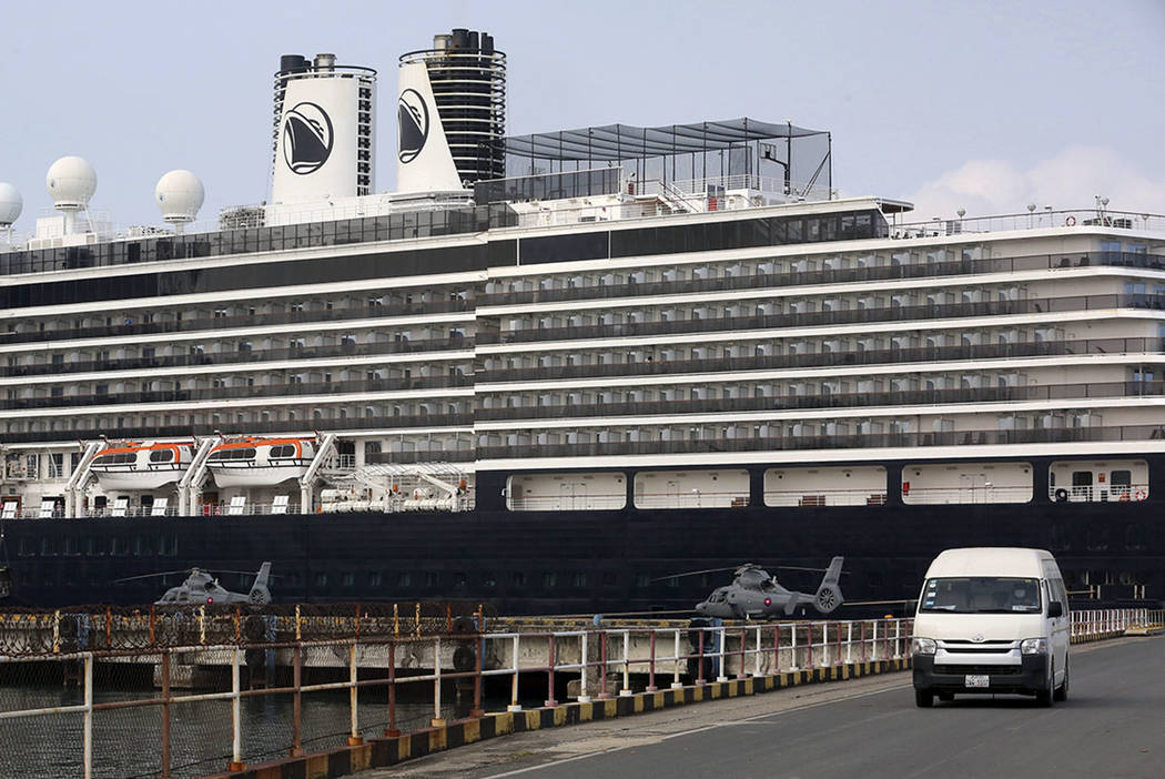 Two Cambodian military helicopters are parked at the port where the MS Westerdam is docked in S ...