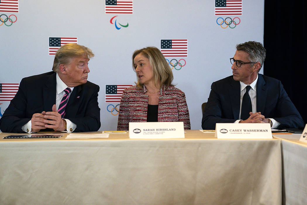 President Donald Trump, left, and LA 2028 Committee Chairman Casey Wasserman, right, listen as ...