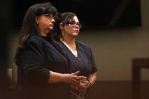 Cassie Smith, right, charged in the death of her 3-year-old son, Daniel Theriot, listens during ...