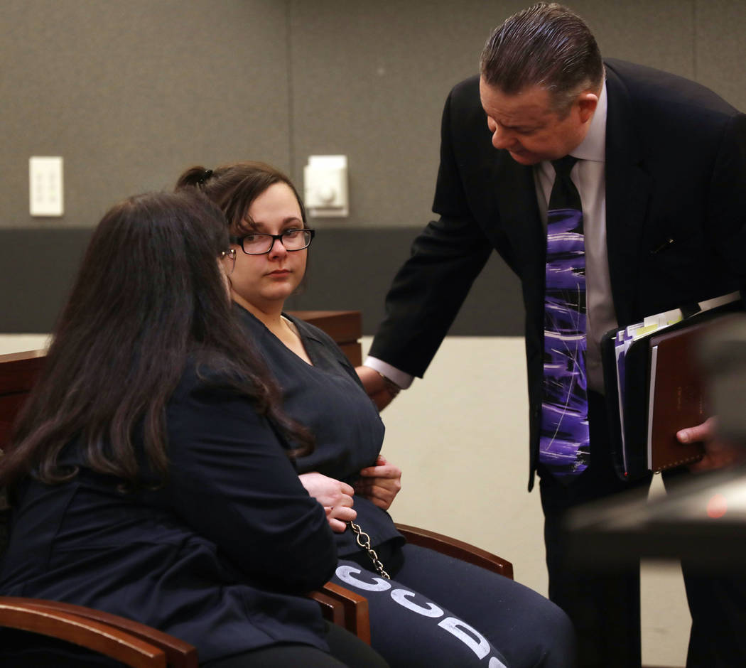 Cassie Smith, center, listens to her attorneys, Melinda Simpkins, left, and Clark Patrick, afte ...