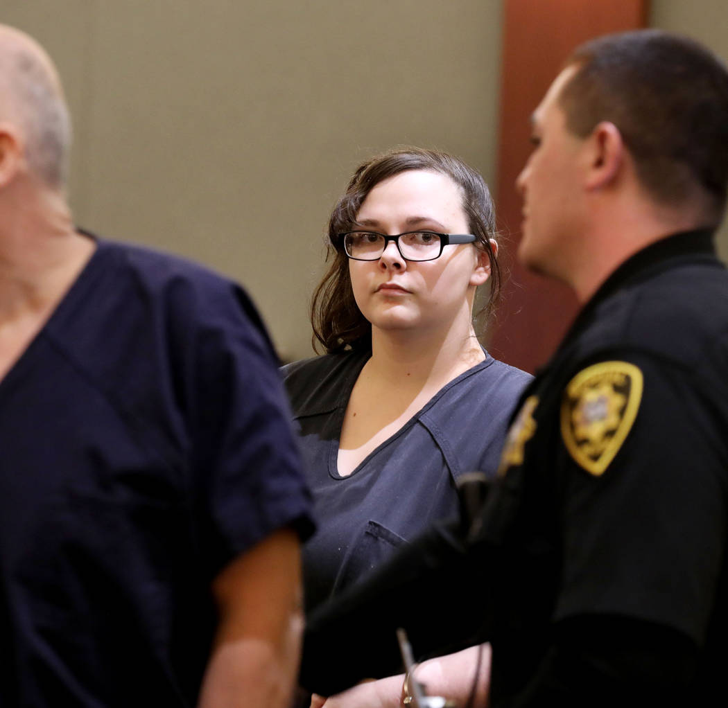 Cassie Smith, charged in the death of her 3-year-old son, Daniel Theriot, enters the courtroom ...